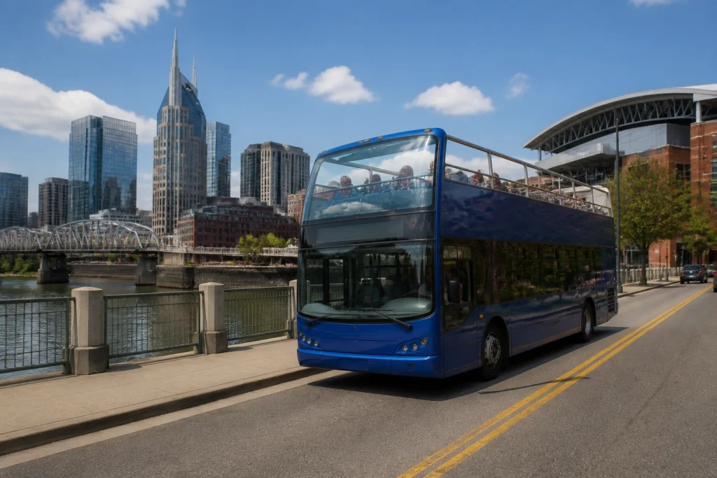 Open-air double-decker sightseeing bus near Nashville’s riverfront.