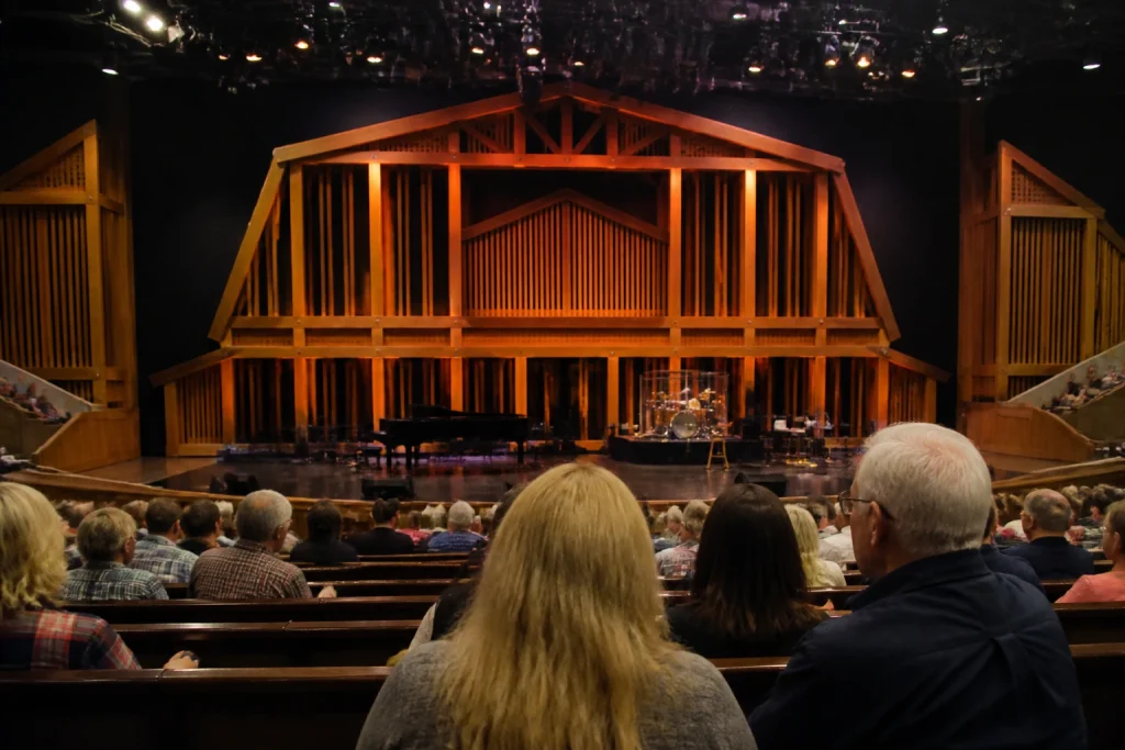 Cushioned pew-style seating inside the Grand Ole Opry House auditorium